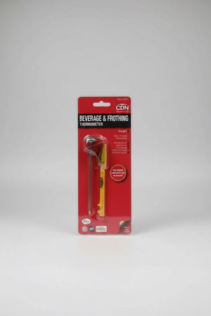 Beverage and frothing thermometer in packaging on a gray background
